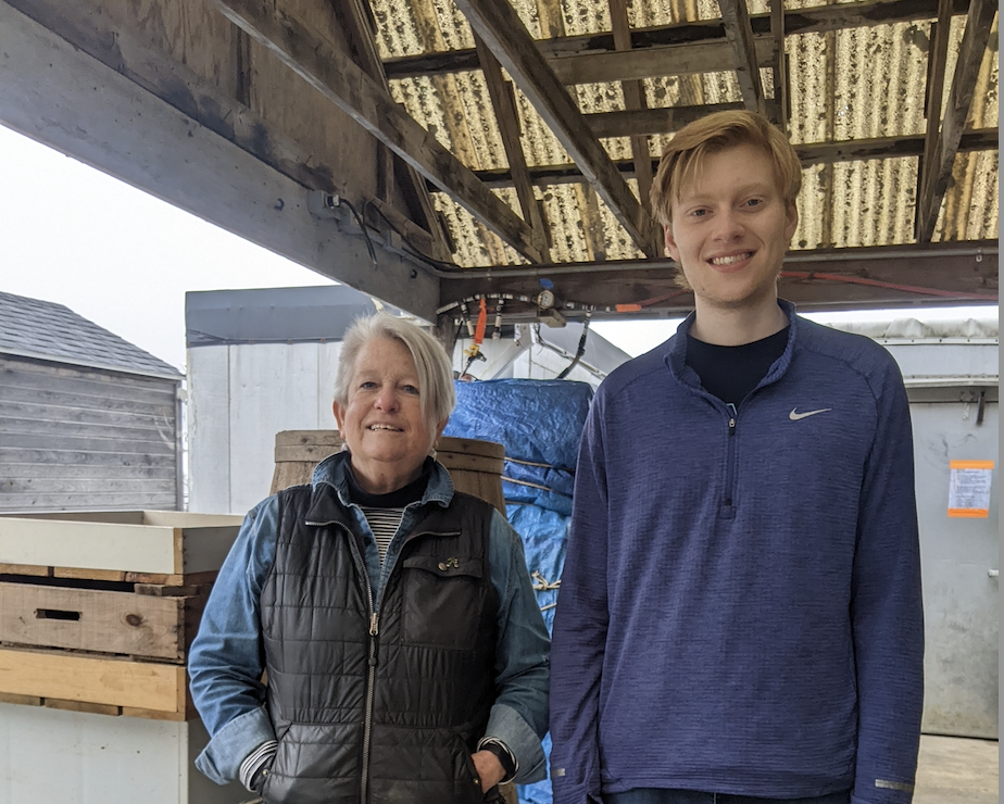 Two people smiling at the camera.